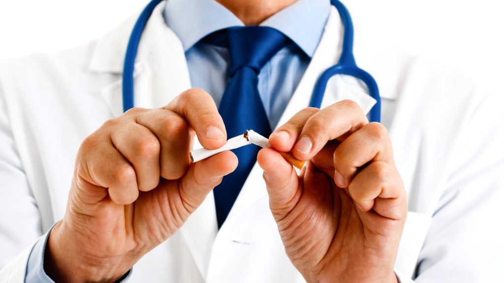 5 Essential Healthy Living Habits For Hidradenitis Suppurativa (Hs) Management a close-up of a doctor breaking a cigarette at the office of a hidradenitis suppurativa specialist near me.