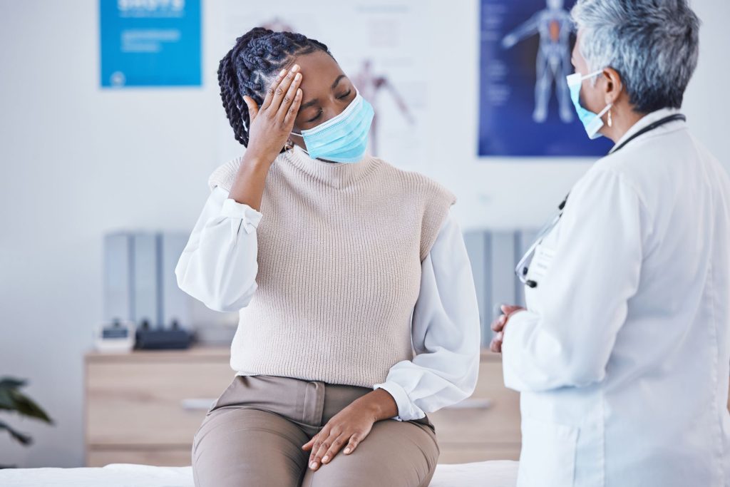 Holistic Approaches To Pain Management In Hidradenitis Suppurativa Care consultation doctor and patient with face mask h 2023 11 27 05 14 33 utc